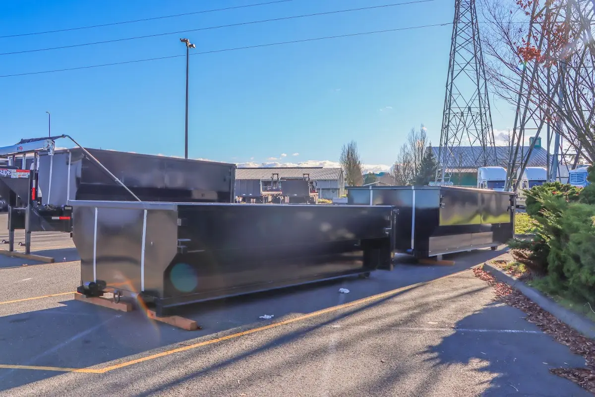Roll-off dumpster ready for waste disposal at job site for 3 Yard Dumpster Rental in Lakewood